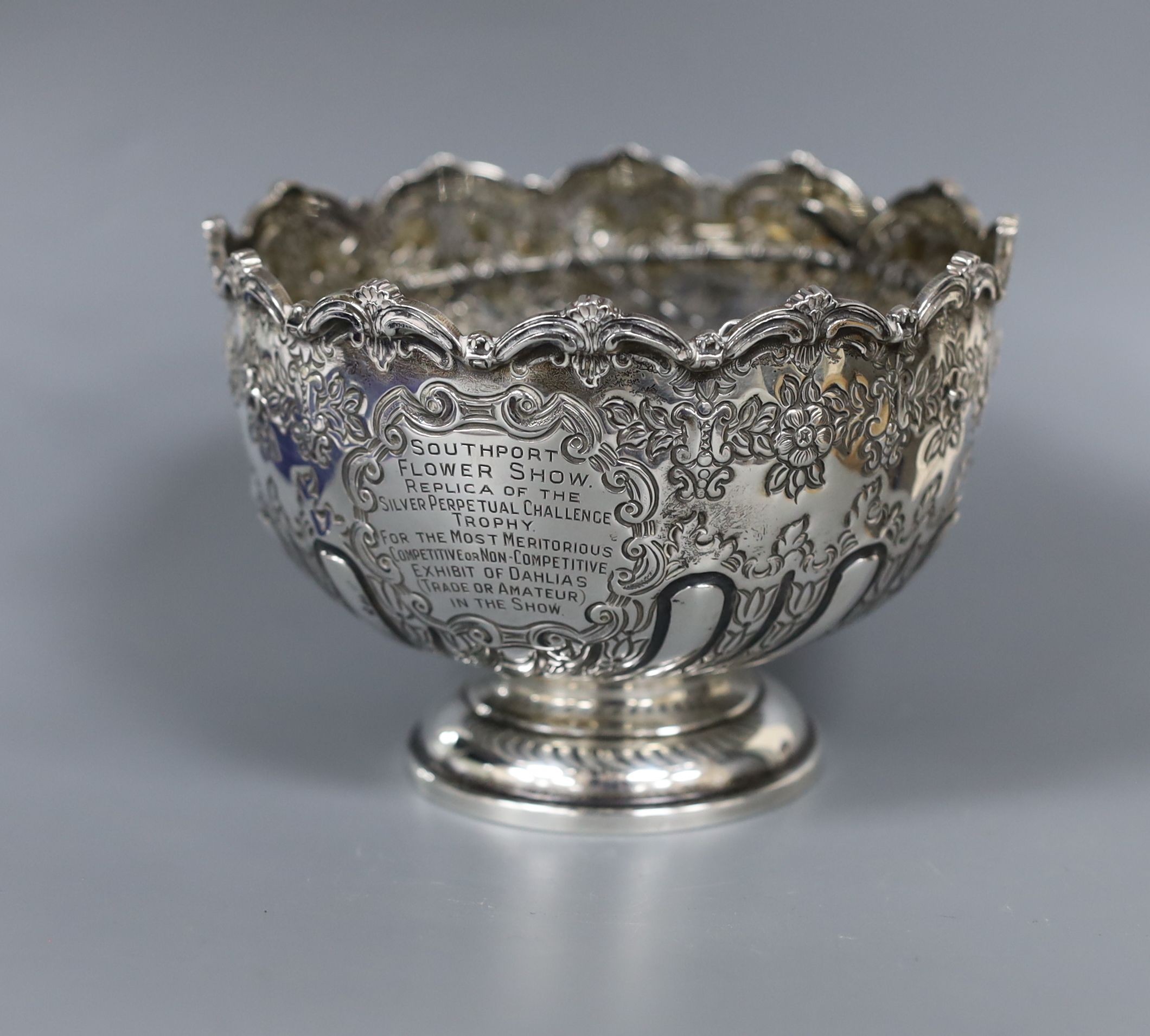 A George V silver small rose bowl, Birmingham, 1913, diameter 12.8cm and a later silver two handled bowl, gross 14.5oz.